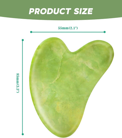 Green gua sha tool with measurements on a white background